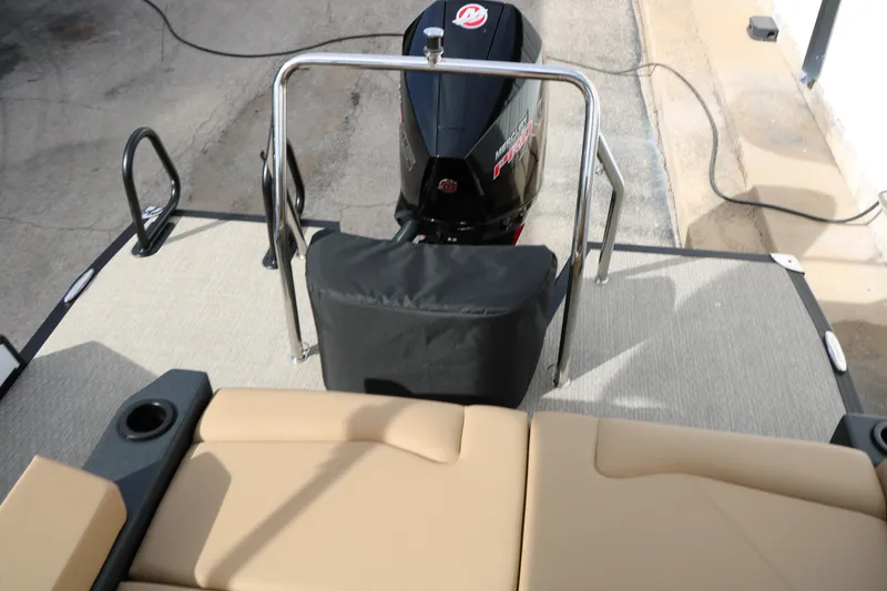 Slide: The Image of 2026 Evotti 523CS boat with Mercury engine, beige seating, and rear deck view. - 42