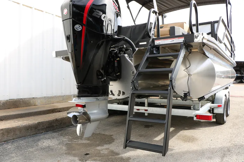 Slide: The Image of Rear view of 2026 Evotti 523CS boat with powerful outboard motor and boarding ladder. - 47