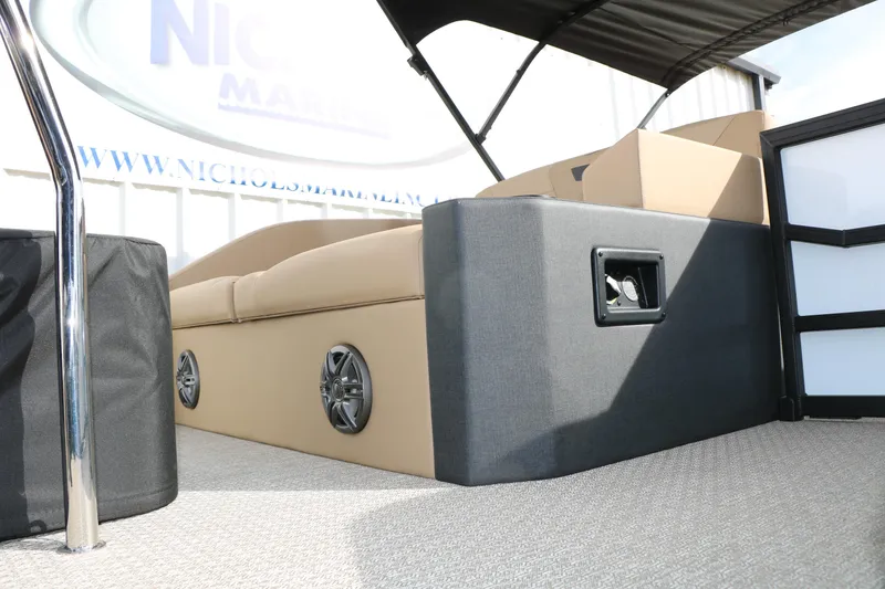 Slide: The Image of Interior of 2026 Evotti 523CS boat with beige seating and speaker system. - 48