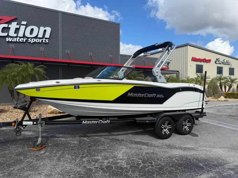 The Image of 2018 MasterCraft NXT20 boat in front of a water sports store. - 1