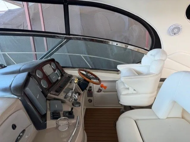 Slide: The Image of Interior of a 2004 Sea Ray 420 Sundancer yacht with helm station. - 12