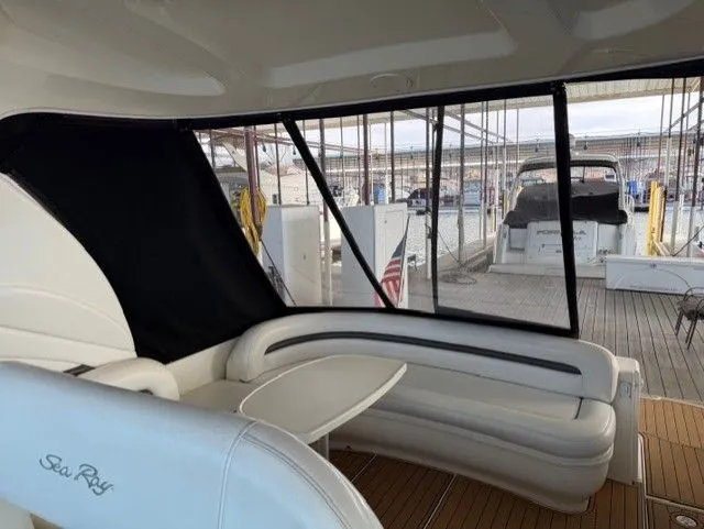 Slide: The Image of Interior of a 2004 Sea Ray 420 Sundancer yacht at the marina. - 14