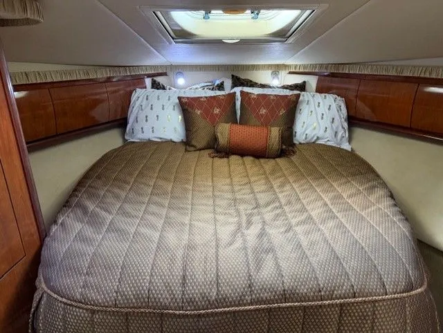 Slide: The Image of Luxurious bedroom in a 2004 Sea Ray 420 Sundancer yacht. - 16