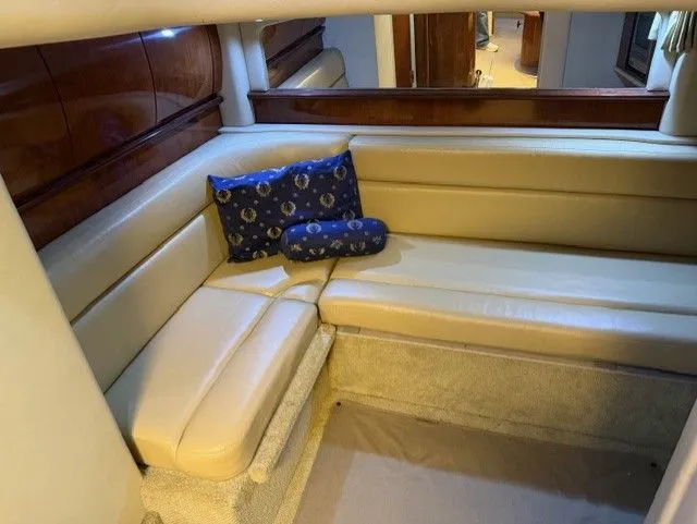 Slide: The Image of Interior of 2004 Sea Ray 420 Sundancer with beige sofa. - 23