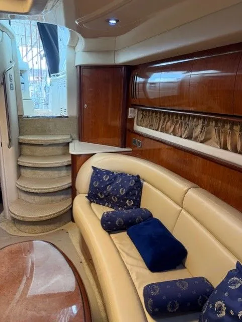 Slide: The Image of Interior of 2004 Sea Ray 420 Sundancer with leather sofa and staircase. - 29