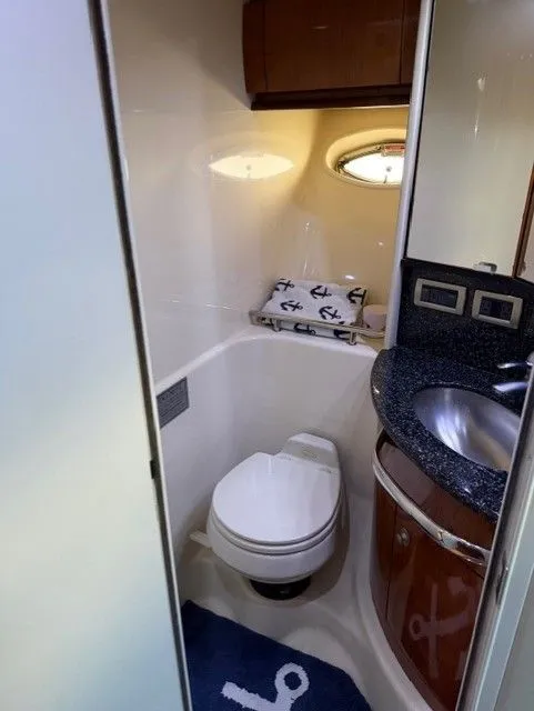 Slide: The Image of Sea Ray 420 Sundancer 2004 bathroom with toilet and sink. - 32