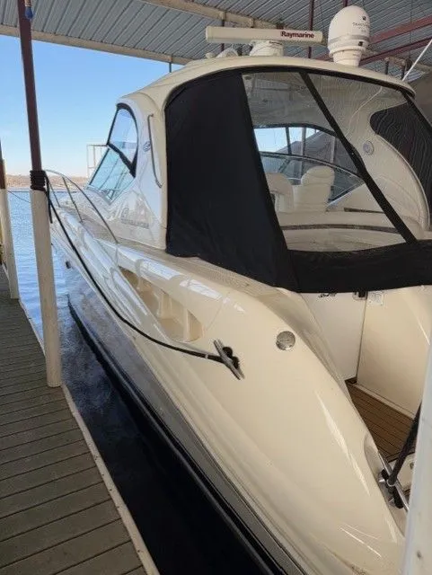 Slide: The Image of 2004 Sea Ray 420 Sundancer docked under cover. - 4