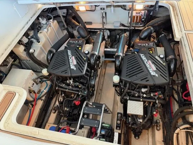 Slide: The Image of Engine room of a 2004 Sea Ray 420 Sundancer with twin Mercury engines. - 40