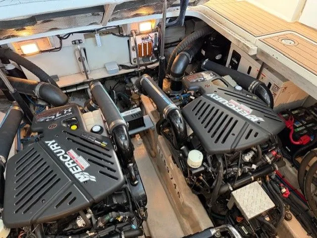 Slide: The Image of Engine room of 2004 Sea Ray 420 Sundancer with Mercury engines. - 44