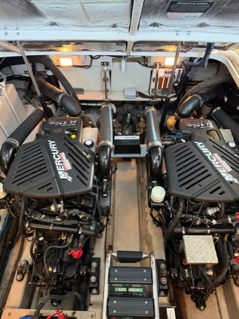 Slide: The Image of Engine room of 2004 Sea Ray 420 Sundancer with Mercury engines. - 46
