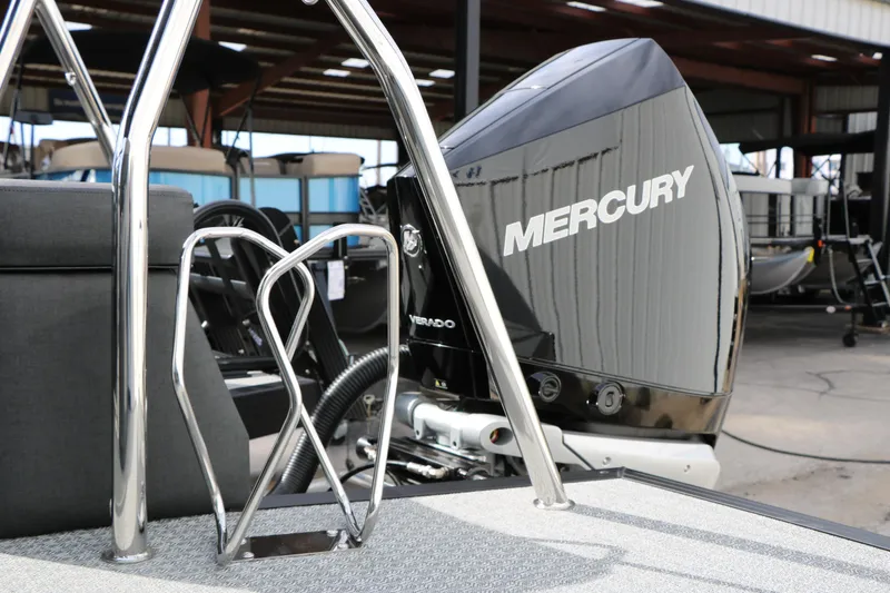 Slide: The Image of 2026 Evotti 723QL boat with Mercury outboard motor in a marina setting. - 11