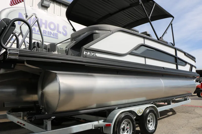 Slide: The Image of 2026 Evotti 723QL pontoon boat on trailer at Nichols Marine dealership. - 16