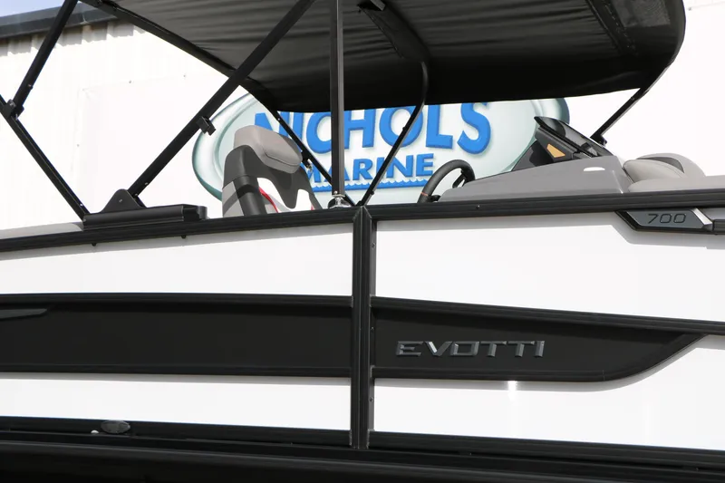 Slide: The Image of 2026 Evotti 723QL boat at Nichols Marine dealership, showcasing sleek design and modern features. - 2
