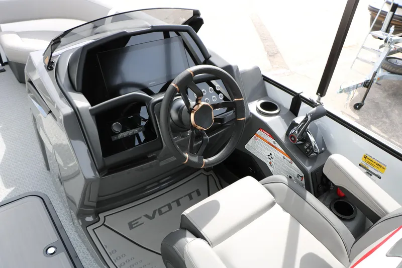 Slide: The Image of 2026 Evotti 723QL boat cockpit with modern steering wheel and control panel. - 34