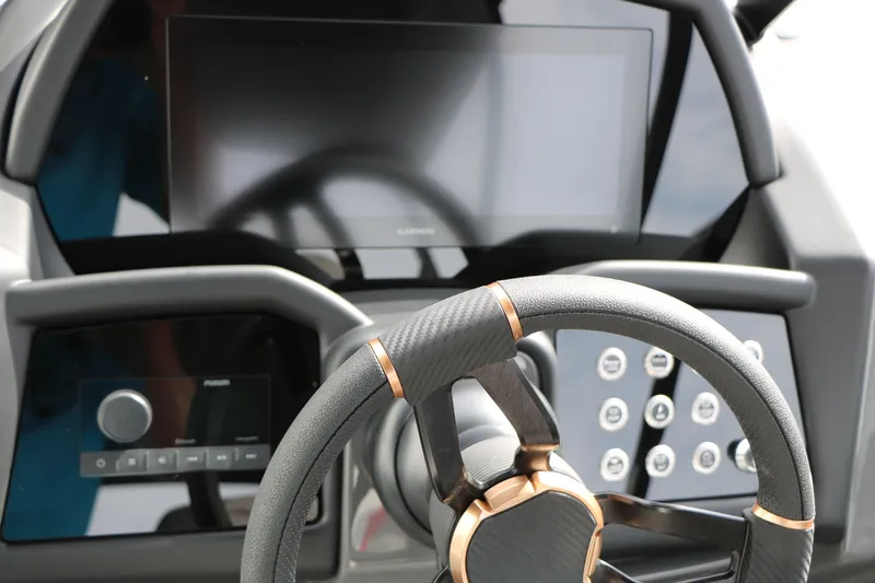 Slide: The Image of Steering wheel and dashboard of 2026 Evotti 723QL with modern controls and display. - 37