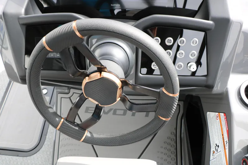 Slide: The Image of Steering wheel of 2026 Evotti 723QL boat with modern dashboard controls. - 52