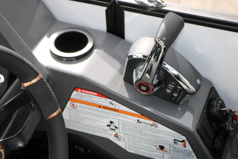 Slide: The Image of Control panel of 2026 Evotti 723QL boat with steering wheel and throttle lever. - 53