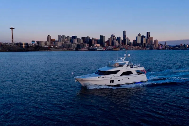 Slide: The Image of Ocean Alexander 72 Pilothouse yacht cruising near Seattle skyline, 2013 model. - 2