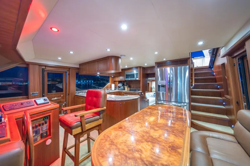 Slide: The Image of Luxurious interior of 2013 Ocean Alexander 72 Pilothouse yacht with modern kitchen and seating area. - 24