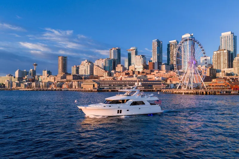 Slide: The Image of Ocean Alexander 72 Pilothouse yacht cruising near city skyline and Ferris wheel, 2013 model. - 3