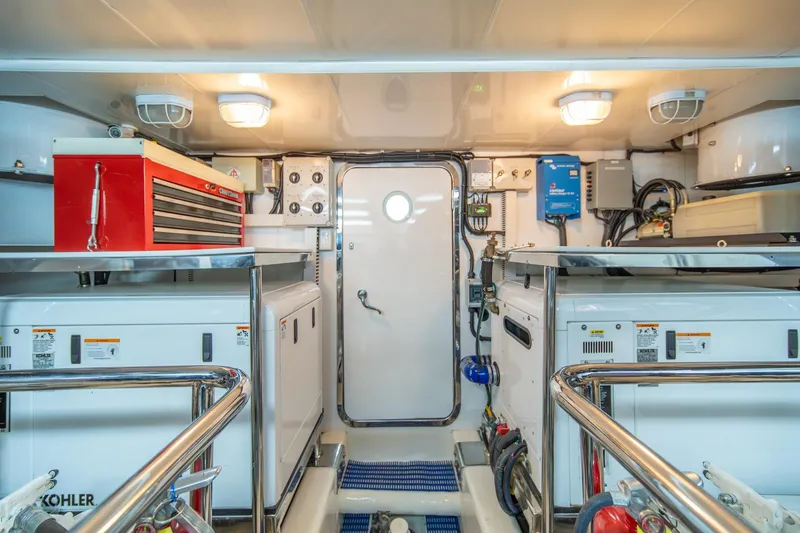 Slide: The Image of Engine room of 2013 Ocean Alexander 72 Pilothouse yacht, featuring equipment and storage. - 39