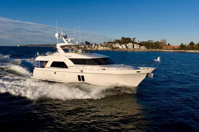 Slide: The Image of 2013 Ocean Alexander 72 Pilothouse yacht cruising on open water. - 4