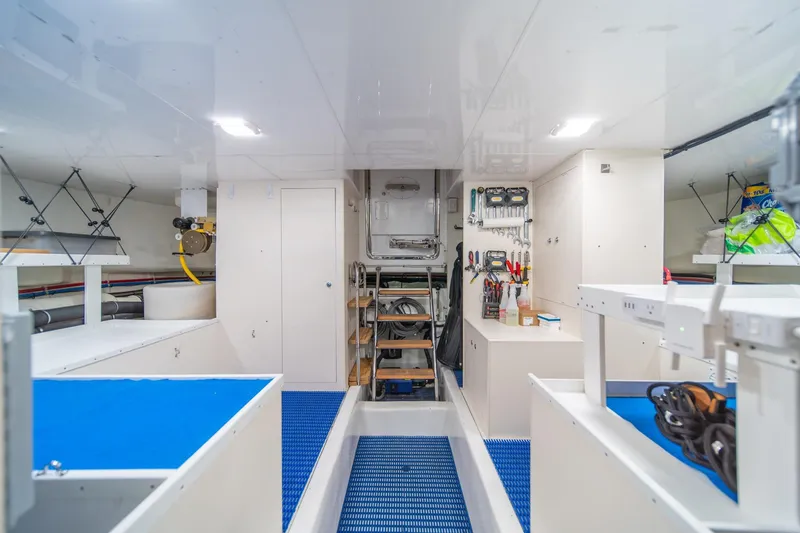 Slide: The Image of Engine room of 2013 Ocean Alexander 72 Pilothouse yacht, featuring organized tools and equipment. - 41