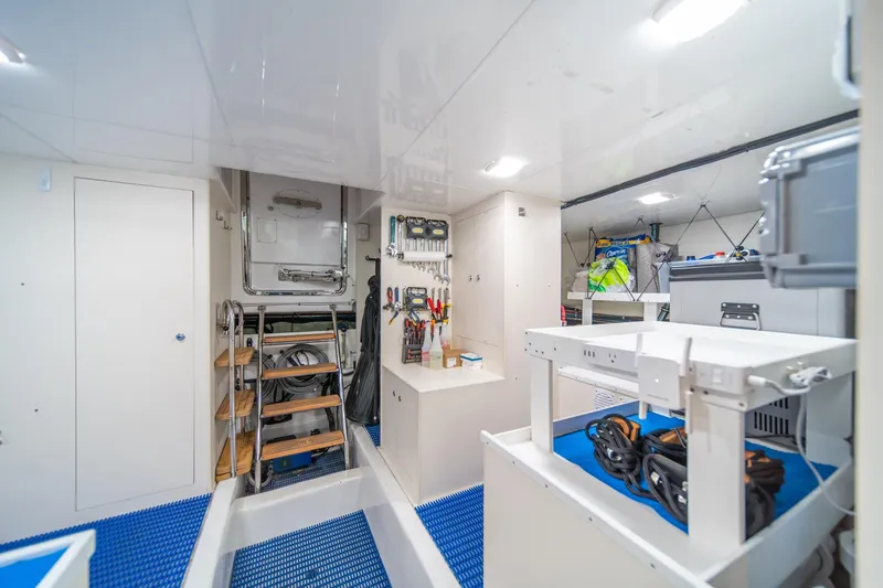 Slide: The Image of Engine room of 2013 Ocean Alexander 72 Pilothouse yacht, featuring tools and equipment. - 44