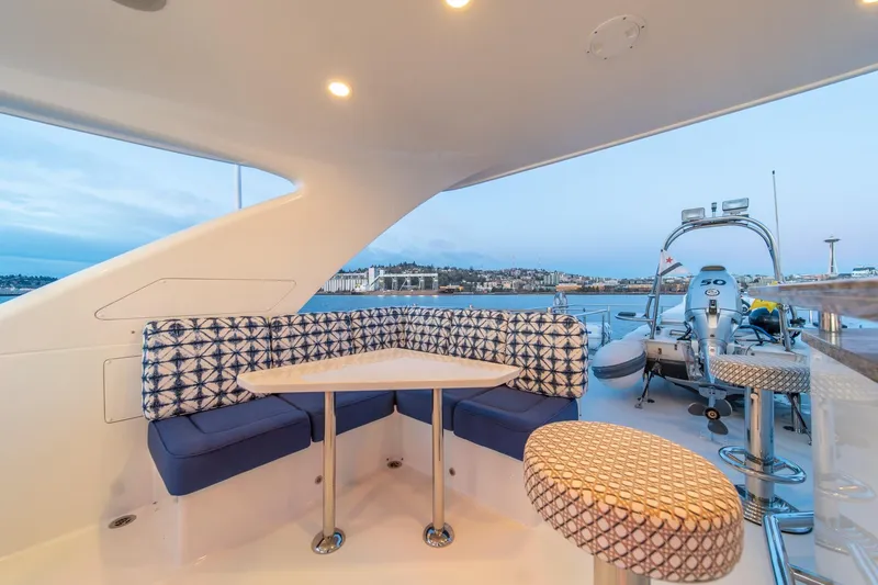 Slide: The Image of Luxurious seating area on 2013 Ocean Alexander 72 Pilothouse yacht with scenic waterfront view. - 9