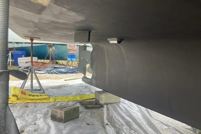 Slide: The Image of Underneath view of a 1986 BGM Custom boat, showing propeller and support setup. - 33