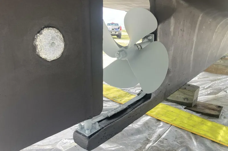 Slide: The Image of Boat propeller and rudder of a 1986 BGM Custom vessel on a maintenance platform. - 38
