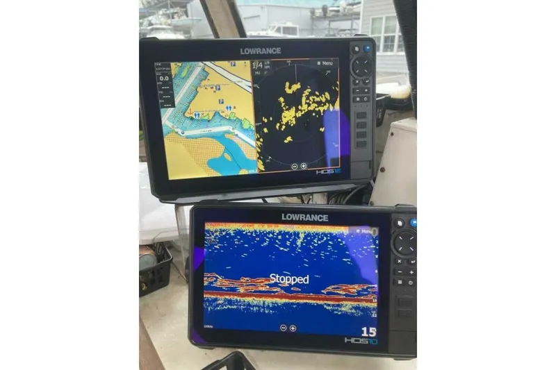 Slide: The Image of Two Lowrance marine navigation displays on a 1986 BGM Custom boat. - 28