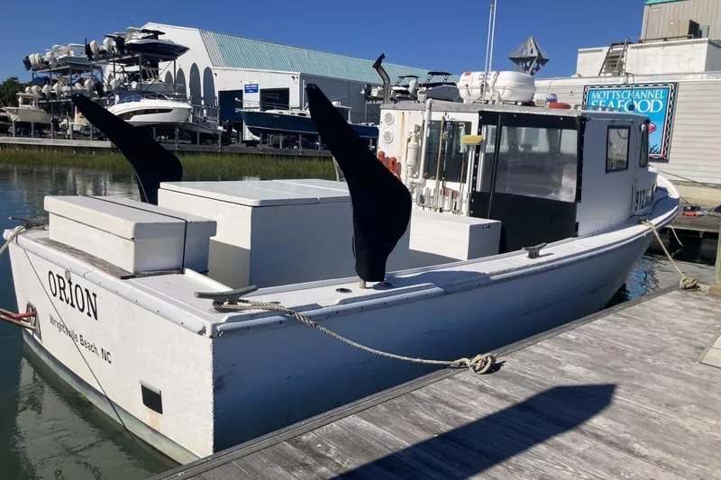 Slide: The Image of 1986 BGM Custom boat "Orion" docked at Wrightsville Beach, NC marina. - 29