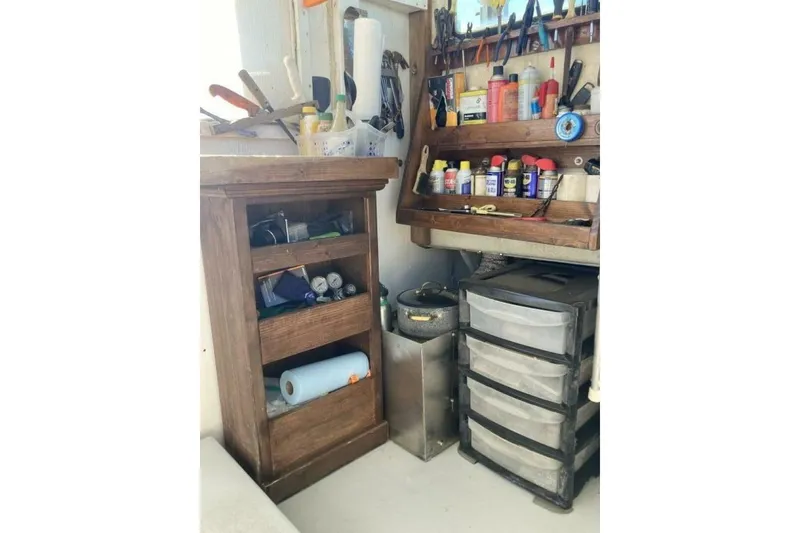 Slide: The Image of Workshop with organized tools, wooden shelves, and storage drawers, BGM Custom 1986. - 22