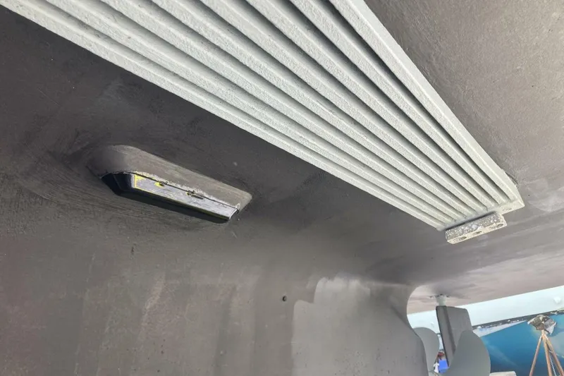 Slide: The Image of Underside view of a 1986 BGM Custom vehicle with visible components and detailing. - 43