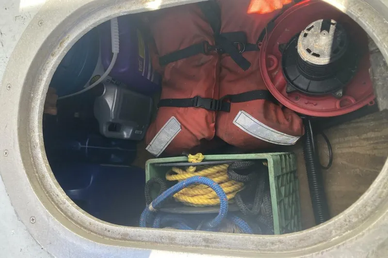 Slide: The Image of Storage compartment with safety gear, ropes, and equipment in a 1986 BGM Custom model. - 10