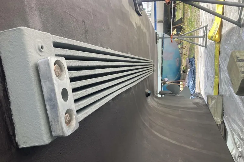 Slide: The Image of Close-up of a 1986 BGM Custom boat hull with metal fittings. - 40