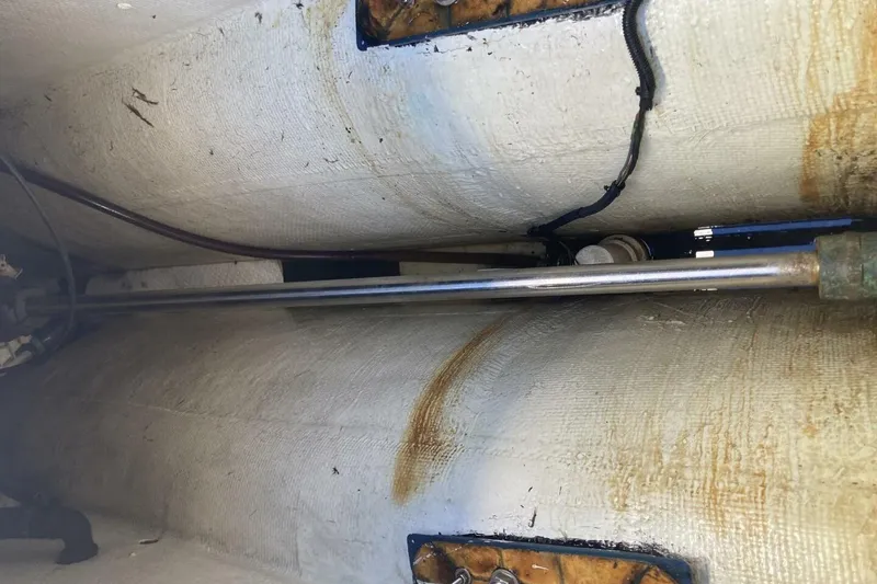 Slide: The Image of 1986 BGM Custom boat interior showing metal rod and wiring in fiberglass hull. - 9