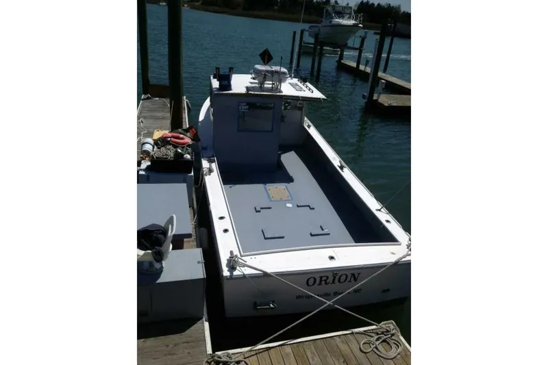 Slide: The Image of 1986 BGM Custom boat docked, named "Orion," at Wrightsville Beach, NC. - 5