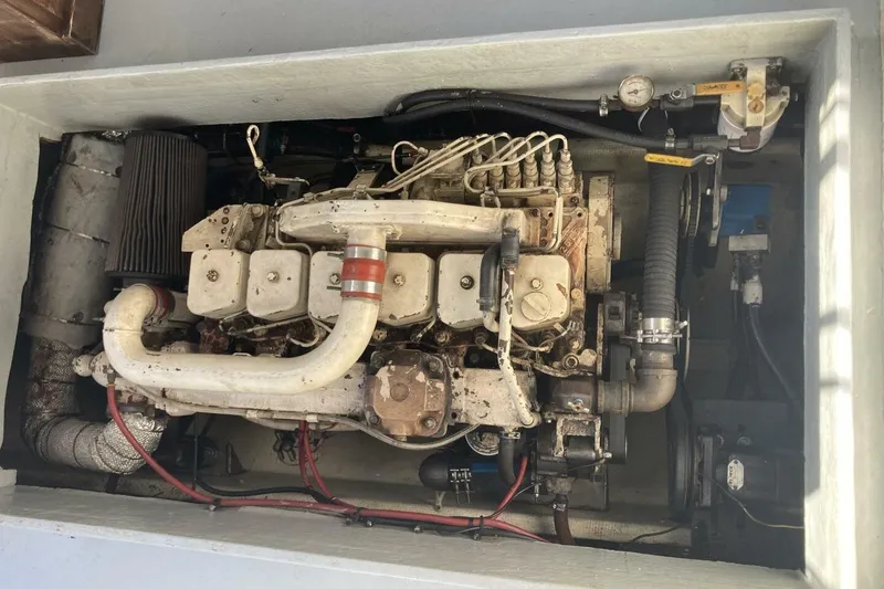 Slide: The Image of 1986 BGM Custom engine in compartment, showcasing mechanical components and piping. - 13