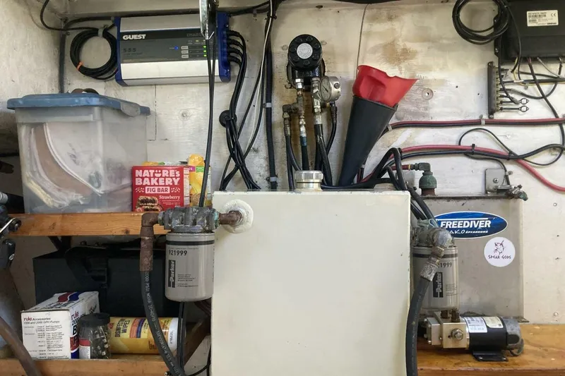Slide: The Image of Engine room with BGM Custom 1986 components, wiring, and storage shelves. - 20