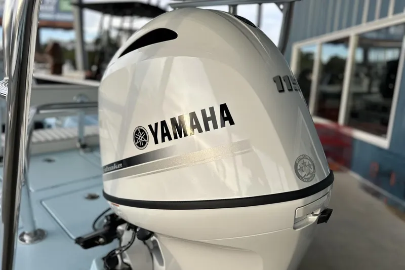 Slide: The Image of 2024 Maverick 18 HPX-V with Yamaha outboard motor, sleek design in a marina setting. - 11