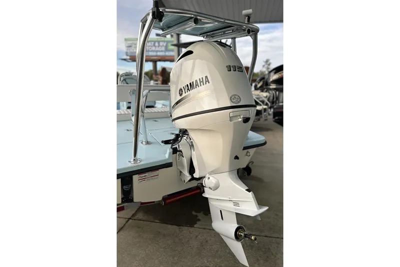 Slide: The Image of 2024 Maverick 18 HPX-V boat with Yamaha 115 outboard motor, rear view. - 12