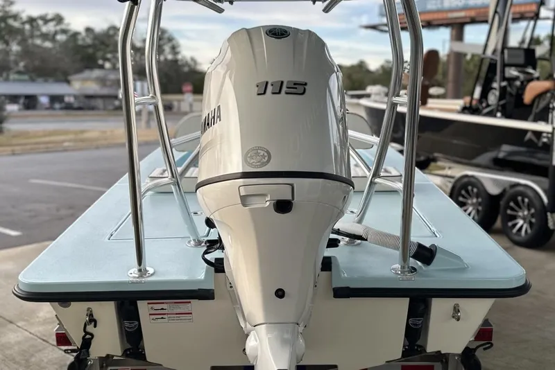 Slide: The Image of 2024 Maverick 18 HPX-V boat with Yamaha 115 outboard motor, rear view. - 13