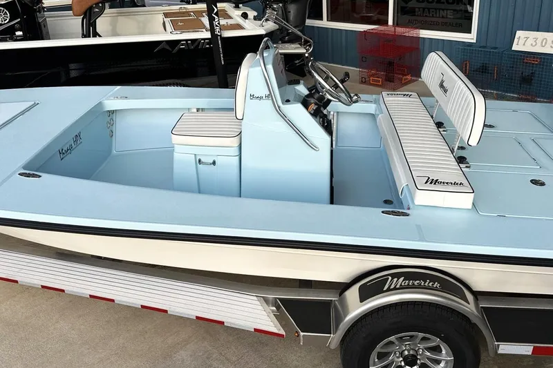 Slide: The Image of 2024 Maverick 18 HPX-V boat with sleek design and comfortable seating on a trailer. - 17