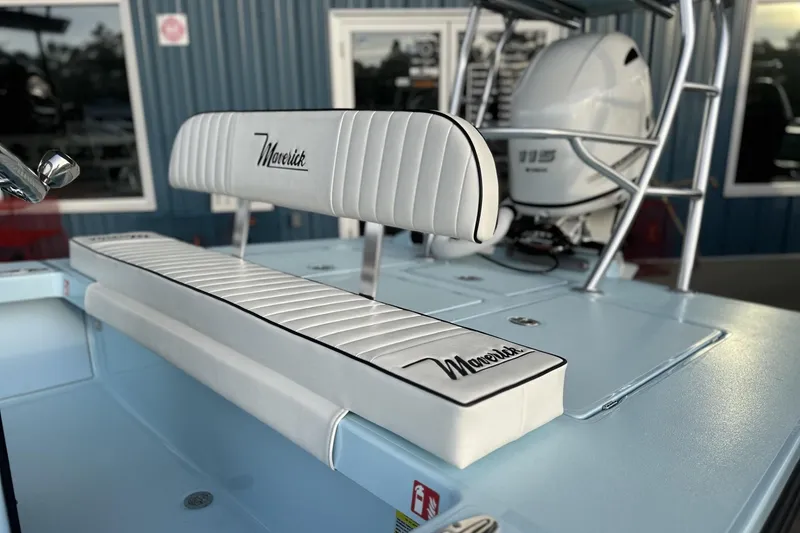 Slide: The Image of 2024 Maverick 18 HPX-V boat interior with white seating and Yamaha outboard motor. - 2