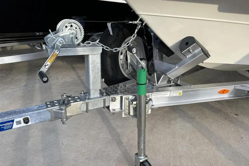 Slide: The Image of 2024 Maverick 18 HPX-V boat trailer hitch and winch system on concrete surface. - 9