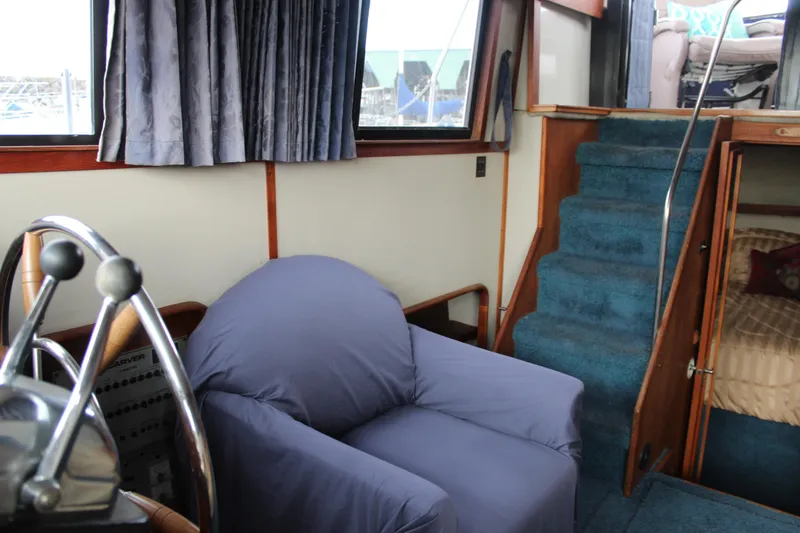 Slide: The Image of Interior of 1987 Carver 36 Aft Cabin Motor Yacht with blue carpet and seating. - 17