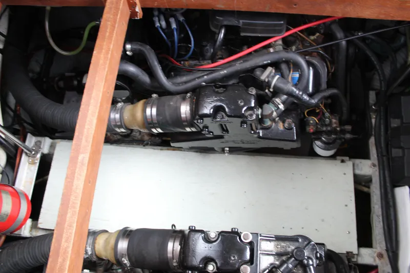 Slide: The Image of Engine compartment of a 1987 Carver 36 Aft Cabin Motor Yacht, showing mechanical components. - 29