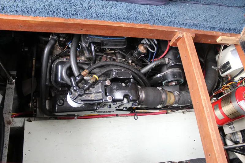 Slide: The Image of Engine compartment of 1987 Carver 36 Aft Cabin Motor Yacht, showing mechanical components. - 30